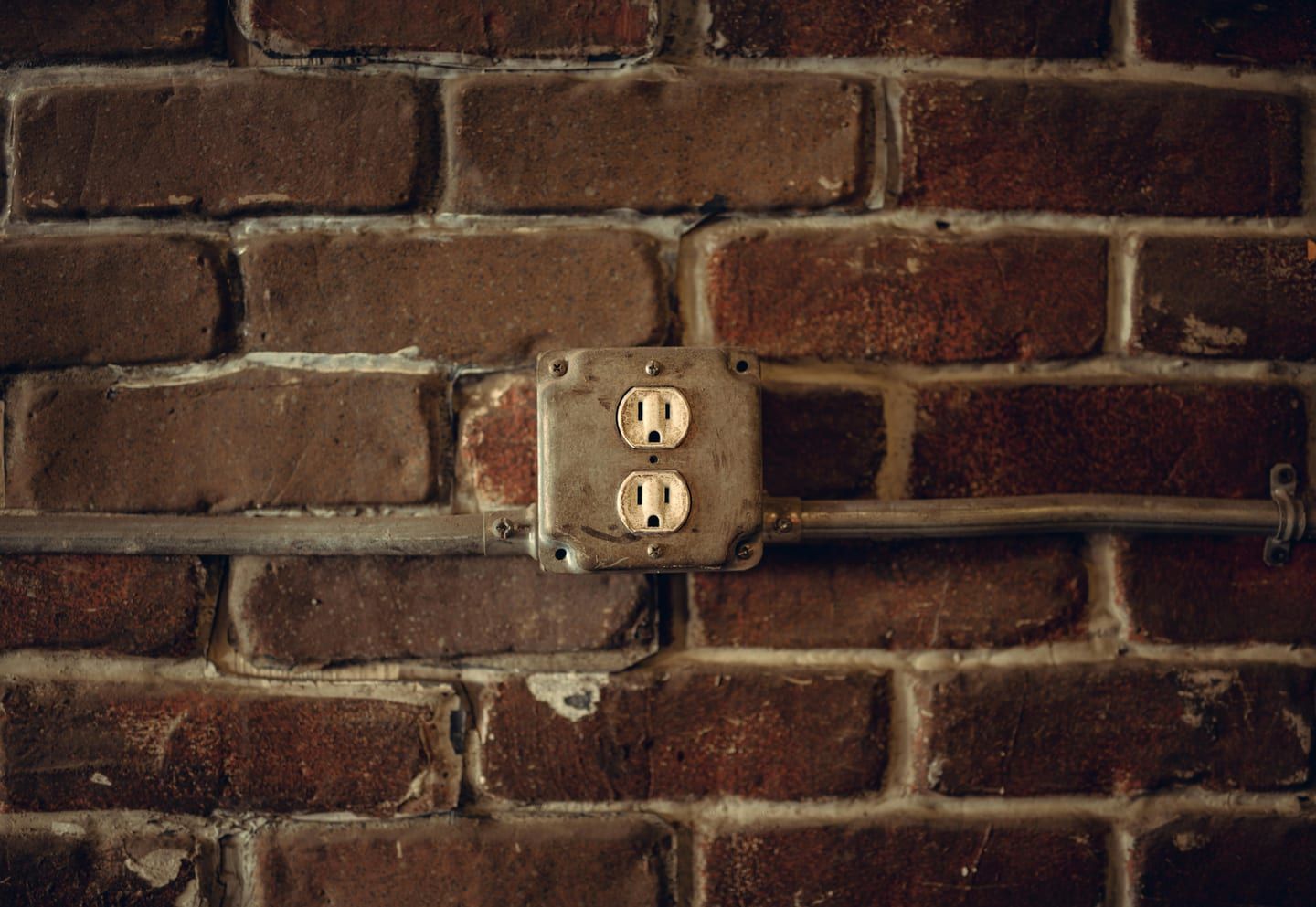 EV charger conduit routed along a garage wall toward the panel