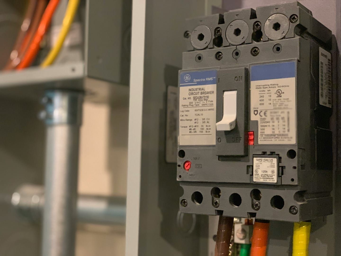An electrical panel being checked for EV charger capacity